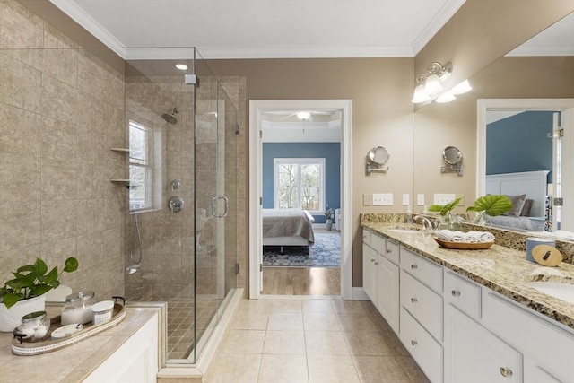 ensuite bathroom with crown molding, a sink, ensuite bath, and a shower stall