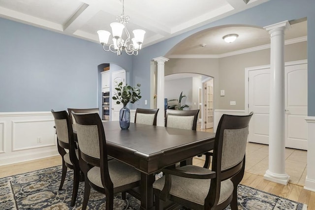 dining room with arched walkways, coffered ceiling, beam ceiling, and light wood-style floors