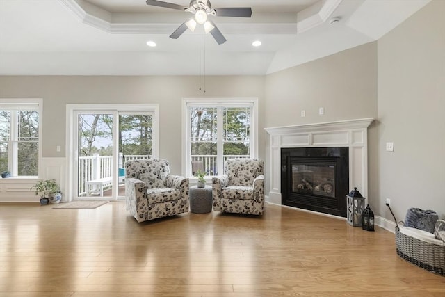 interior space featuring plenty of natural light, ceiling fan, and wood finished floors