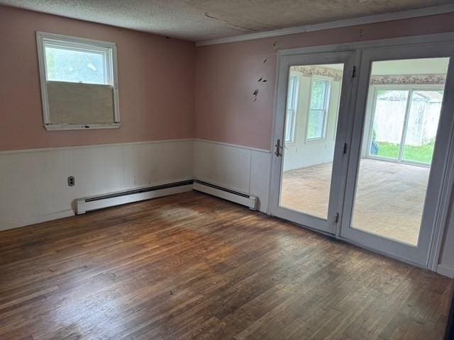 14 Reagan Rd, Townsend, MA 01469 - unfurnished room with healthy amount of natural light, wood finished floors, a textured ceiling, and crown molding