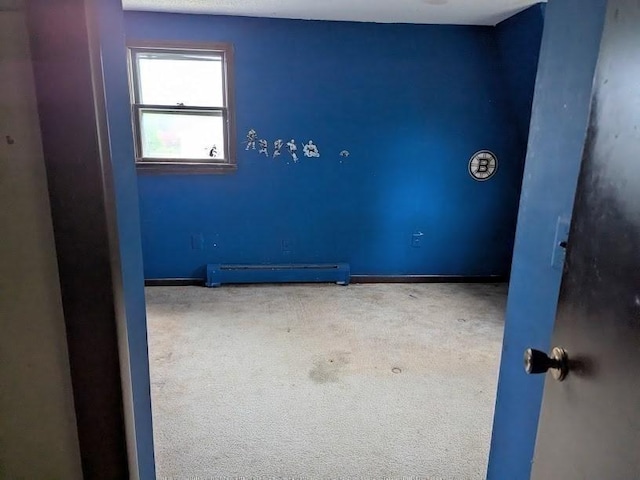 14 Reagan Rd, Townsend, MA 01469 - empty room with baseboard heating, carpet floors, and baseboards