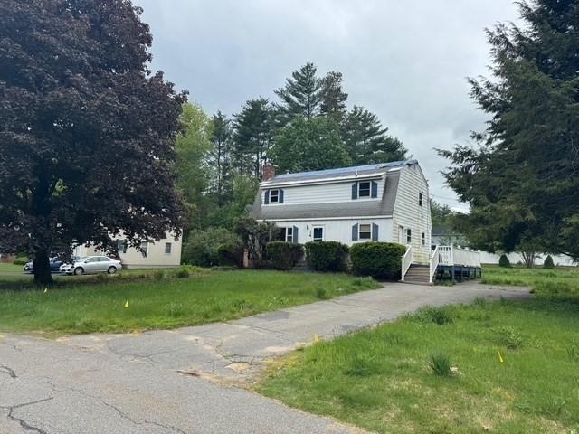 14 Reagan Rd, Townsend, MA 01469 - colonial inspired home with a chimney, a front yard, and asphalt driveway