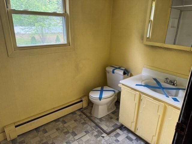 14 Reagan Rd, Townsend, MA 01469 - bathroom with a baseboard heating unit, toilet, vanity, and tile patterned floors