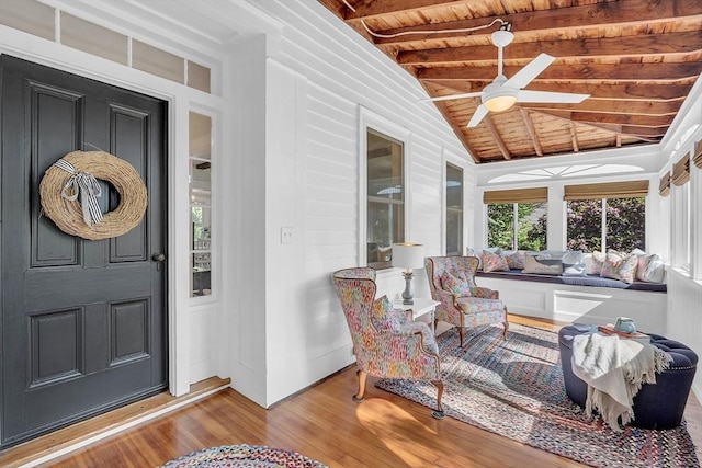 view of exterior entry featuring ceiling fan, an outdoor hangout area, and a porch