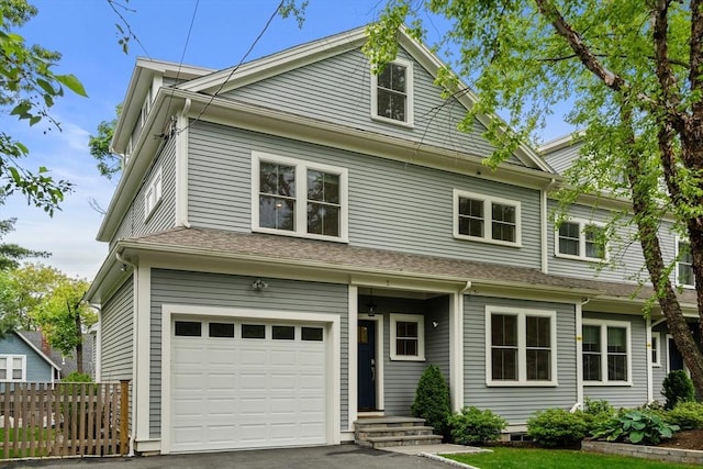 2 Rockwood Ter Unit 2, Newton, MA 02466 - view of front facade with a garage and asphalt driveway