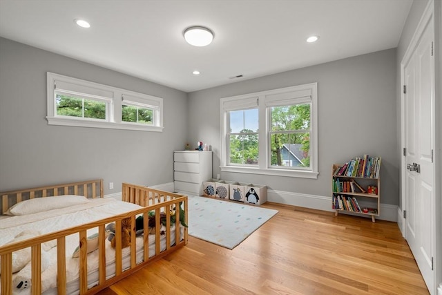 2 Rockwood Ter Unit 2, Newton, MA 02466 - bedroom with light wood-type flooring, recessed lighting, and baseboards