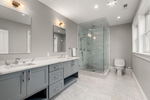 2 Rockwood Ter Unit 2, Newton, MA 02466 - bathroom featuring double vanity, a stall shower, baseboards, toilet, and recessed lighting