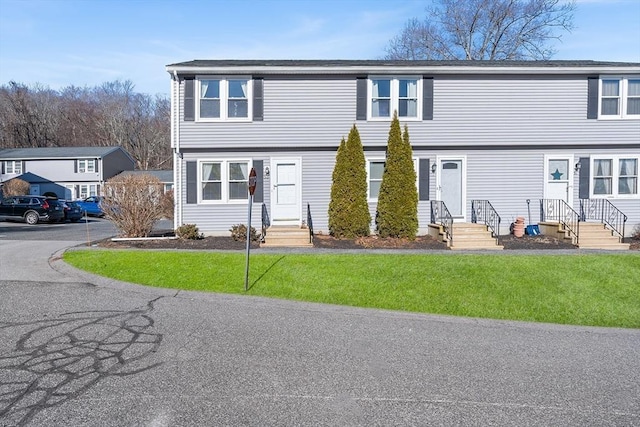 colonial home with a front lawn