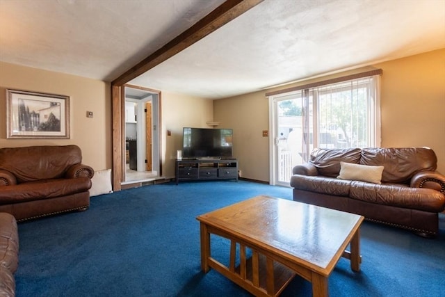 living room with beamed ceiling and carpet floors