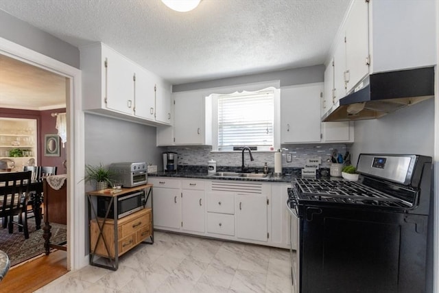 kitchen with white cabinetry, black gas stove, a textured ceiling, and sink