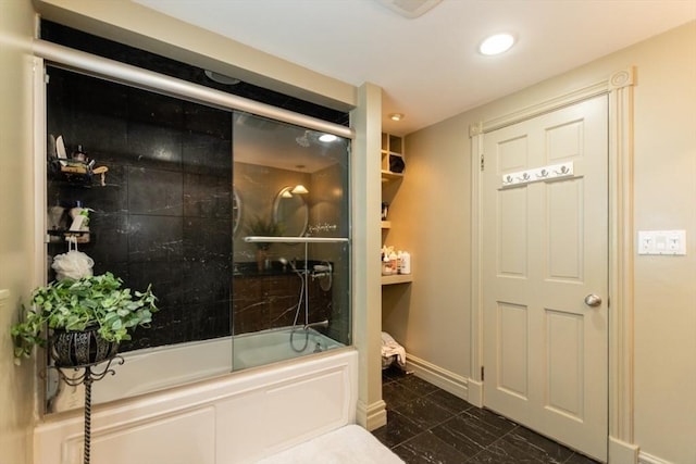 bathroom with enclosed tub / shower combo