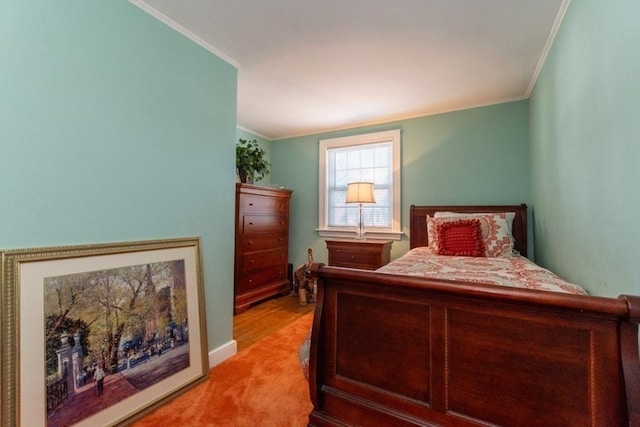 carpeted bedroom featuring ornamental molding