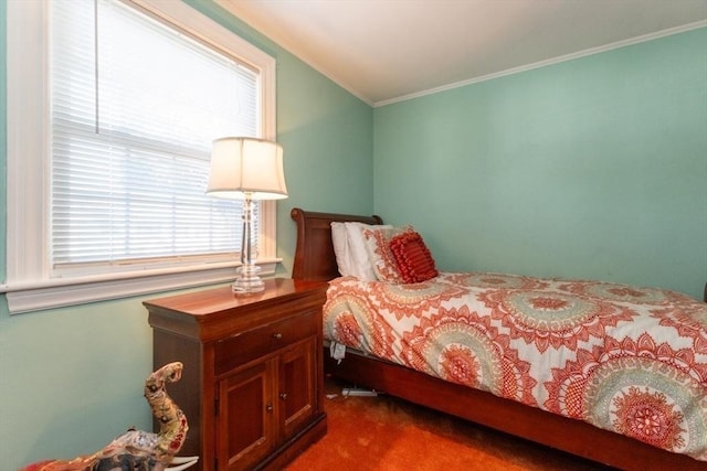 bedroom with carpet and crown molding