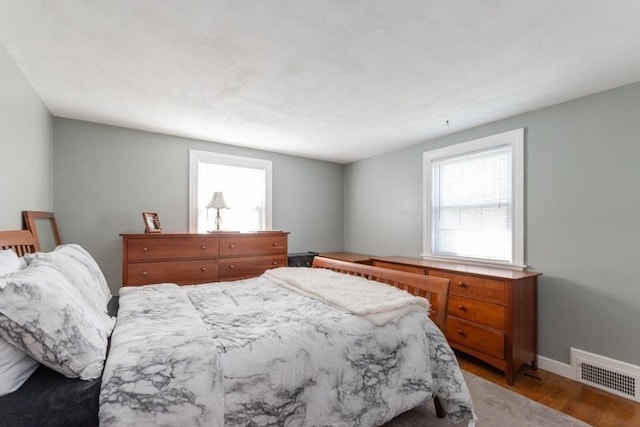 bedroom with hardwood / wood-style flooring