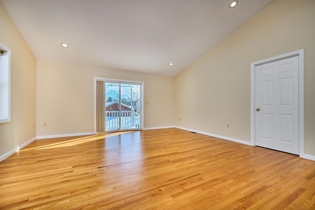 unfurnished room with vaulted ceiling, recessed lighting, baseboards, and light wood finished floors