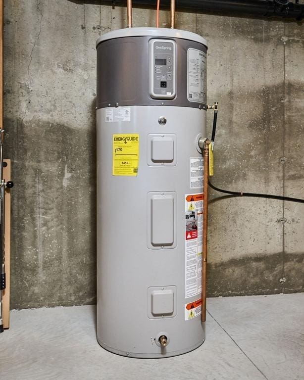 utility room featuring heat pump water heater