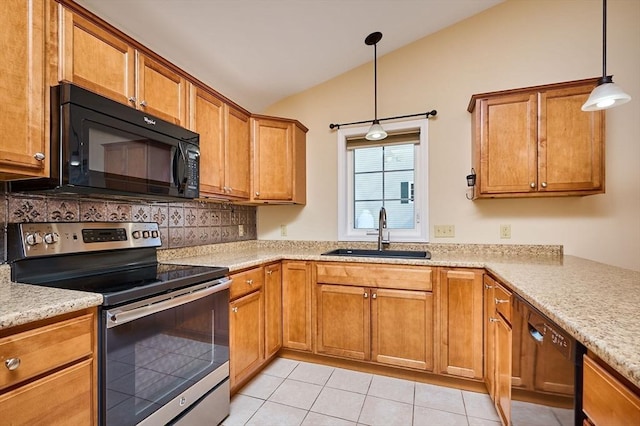 kitchen with brown cabinetry, black appliances, lofted ceiling, and a sink