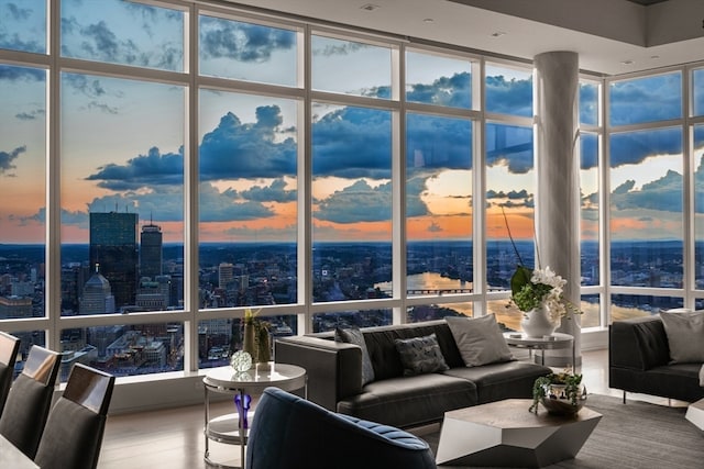 living room with expansive windows and wood-type flooring