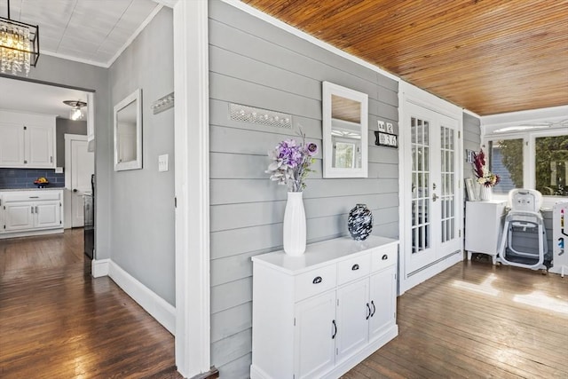 hallway with wooden ceiling, dark wood finished floors, and french doors