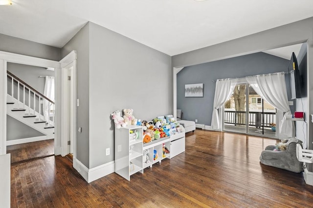 rec room featuring dark wood-style floors and baseboards