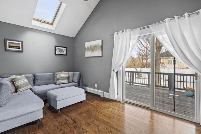 living area featuring dark wood-style flooring, lofted ceiling with skylight, a baseboard radiator, and baseboards