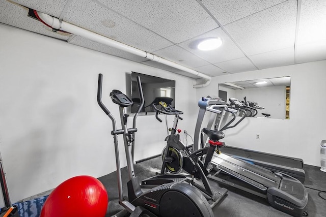 exercise room with a drop ceiling