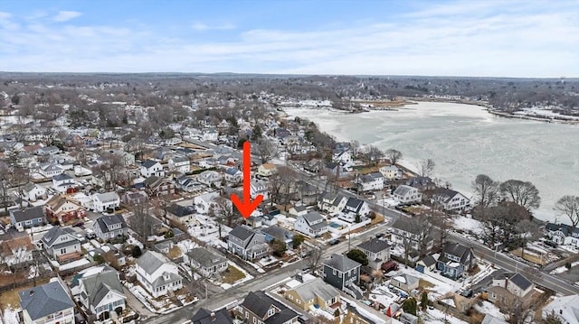 snowy aerial view featuring a residential view