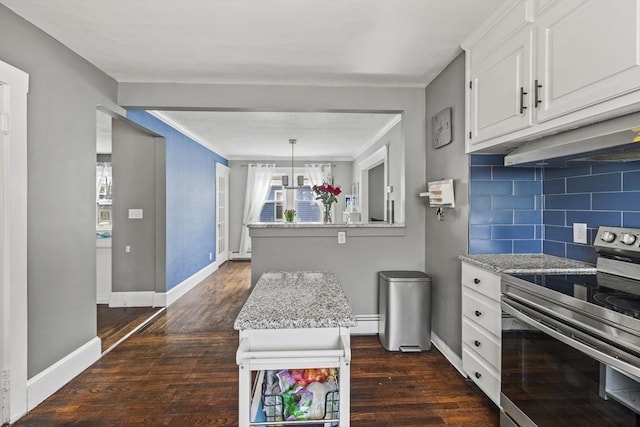 kitchen featuring stainless steel electric range oven, tasteful backsplash, dark wood-type flooring, white cabinetry, and baseboards