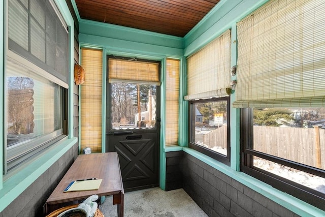 sunroom / solarium featuring wooden ceiling