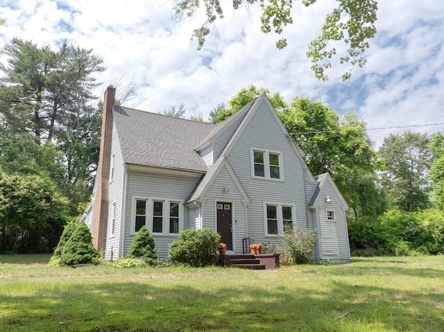 1194 Thorndike St, Palmer, MA 01069 - rear view of house featuring a lawn, a shingled roof, and a chimney