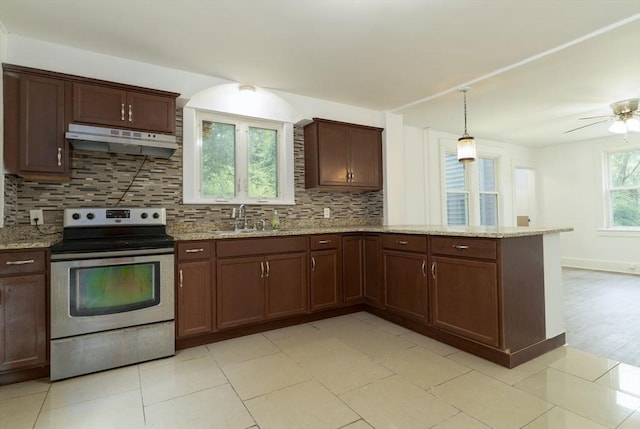 1194 Thorndike St, Palmer, MA 01069 - kitchen with stainless steel electric stove, under cabinet range hood, a peninsula, backsplash, and light stone countertops