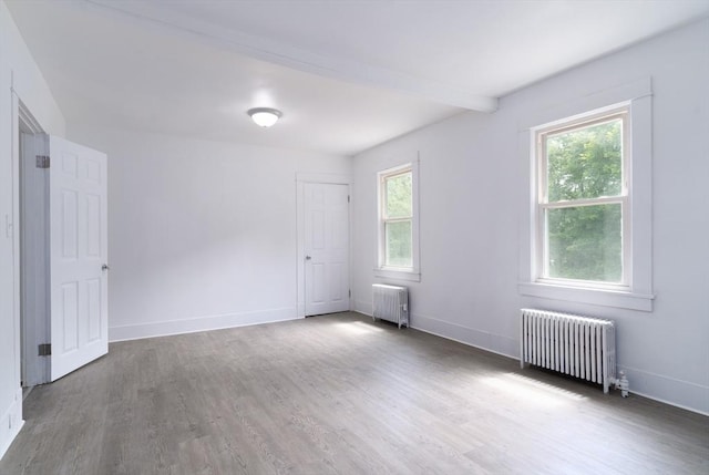 1194 Thorndike St, Palmer, MA 01069 - spare room with radiator and wood finished floors