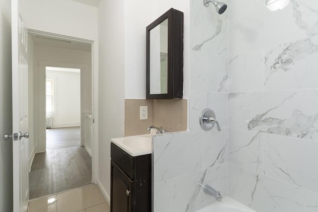 1194 Thorndike St, Palmer, MA 01069 - bathroom featuring radiator heating unit, vanity, and washtub / shower combination