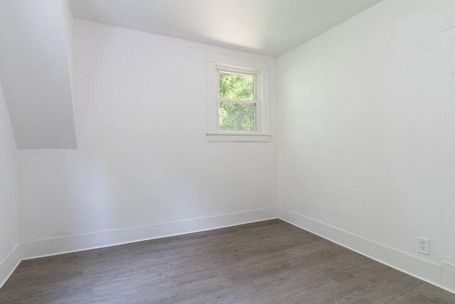 1194 Thorndike St, Palmer, MA 01069 - empty room featuring dark wood-style flooring and vaulted ceiling