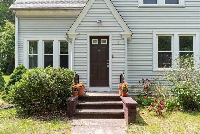 1194 Thorndike St, Palmer, MA 01069 - view of exterior entry with a shingled roof