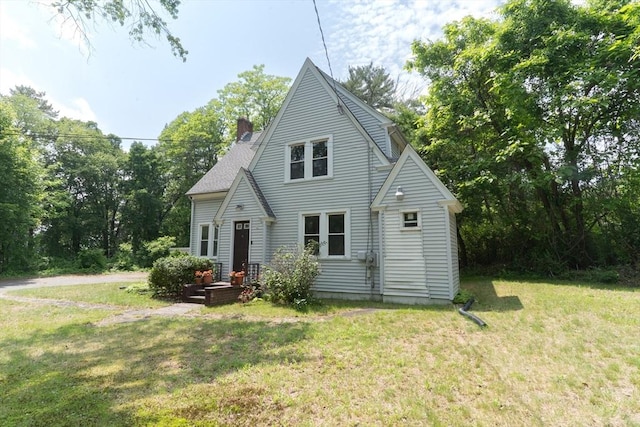 1194 Thorndike St, Palmer, MA 01069 - view of front facade with a front yard and a chimney