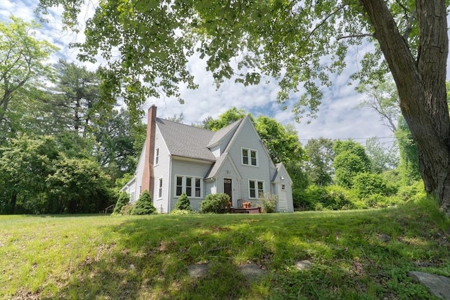 1194 Thorndike St, Palmer, MA 01069 - view of front of property featuring a chimney, a front yard, and roof with shingles