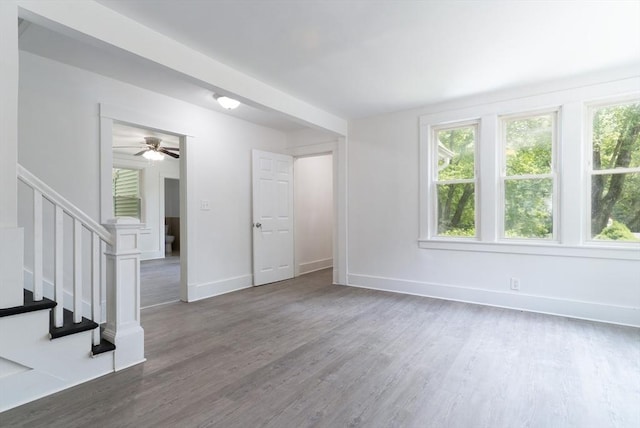 1194 Thorndike St, Palmer, MA 01069 - unfurnished living room featuring plenty of natural light, wood finished floors, stairs, and ceiling fan