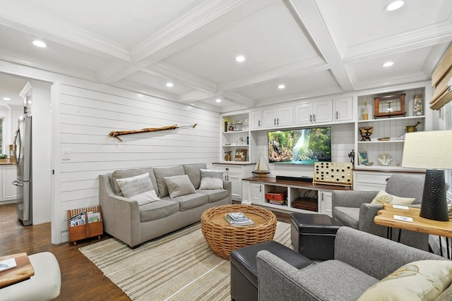 living room featuring coffered ceiling, hardwood / wood-style flooring, beam ceiling, wooden walls, and crown molding