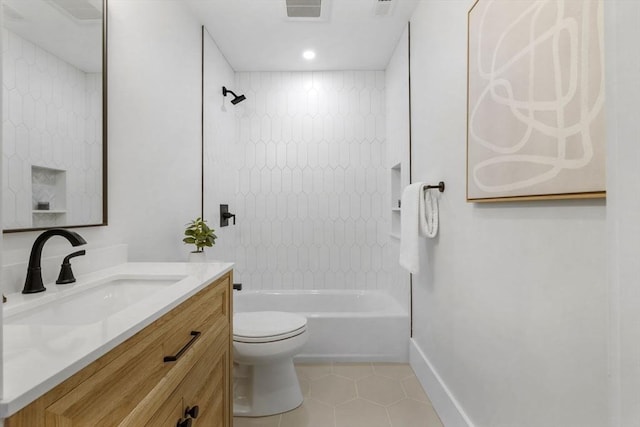 full bathroom featuring toilet, tiled shower / bath, tile patterned floors, and vanity