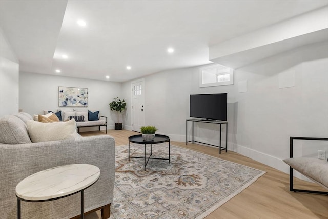 living room with light hardwood / wood-style flooring