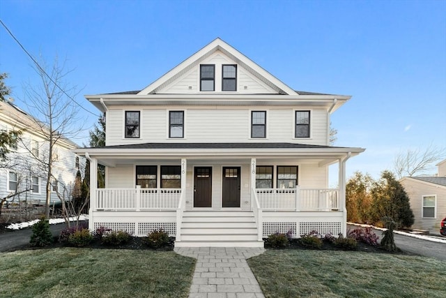 view of front of house featuring covered porch and a front yard