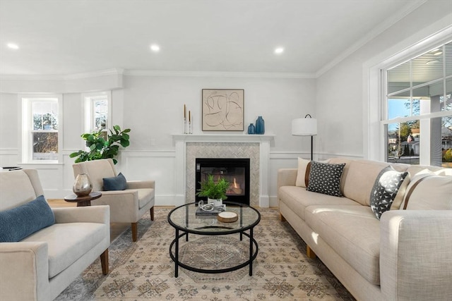 living room with a wealth of natural light and crown molding