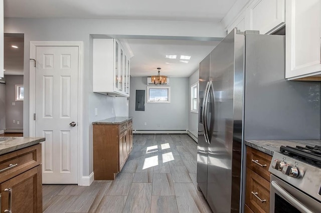 kitchen featuring glass insert cabinets, light stone countertops, white cabinetry, and appliances with stainless steel finishes