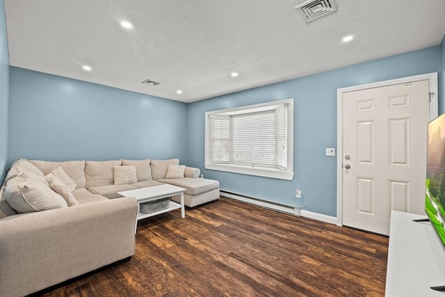 living room featuring dark hardwood / wood-style flooring, a baseboard radiator, and a textured ceiling