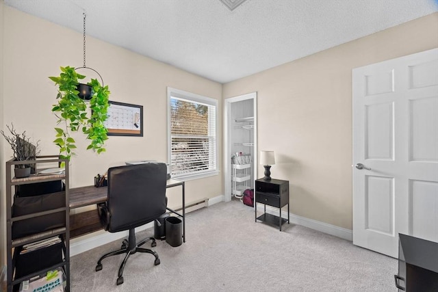 home office with baseboard heating, light colored carpet, and a textured ceiling