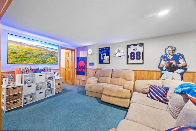 living room featuring carpet and wood walls