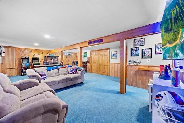 carpeted living room with wooden walls