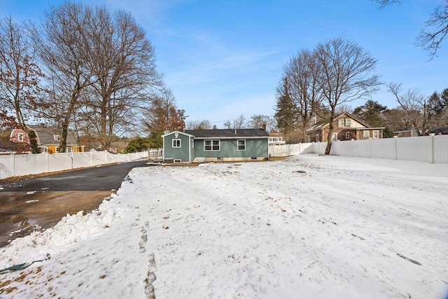 view of snow covered house