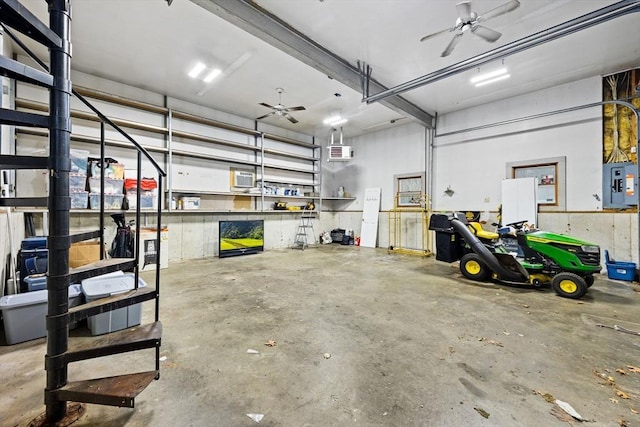 garage featuring electric panel and ceiling fan